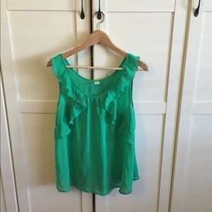 Green and white polka dot ruffled top