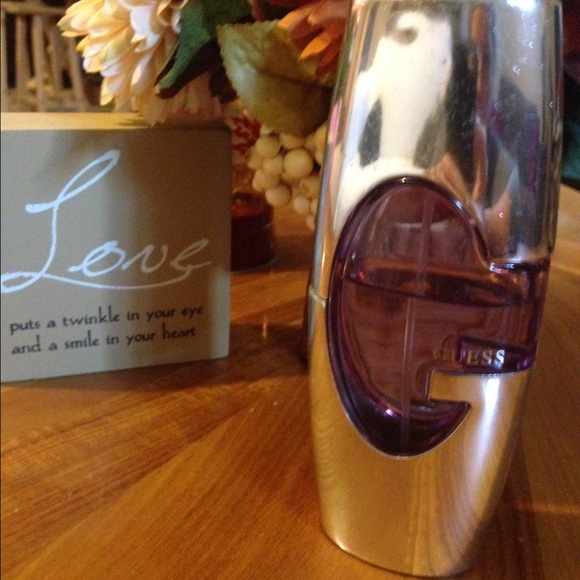 Guess Perfume 2.7 oz over half full.