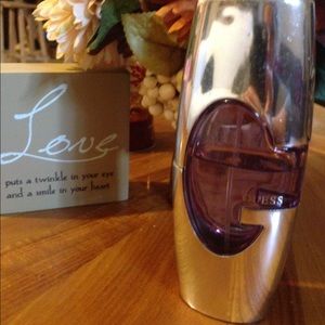 Guess Perfume 2.7 oz over half full.