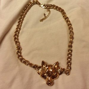 Gold wolf necklace.