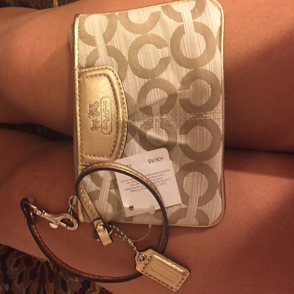 Gold coach wristlet