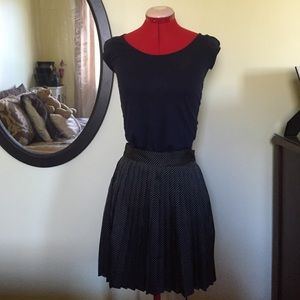 H&M Black pleated skirt with white polka dots.