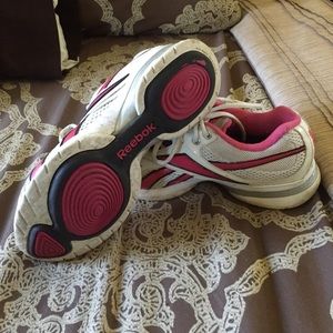 Used pink Reebok easy tone gym shoes.