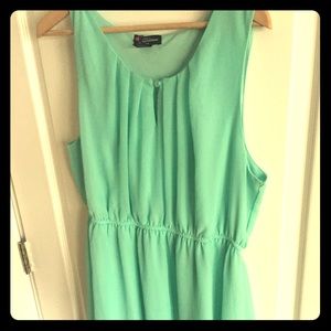 Turquoise dress with tan and blue bock colors.