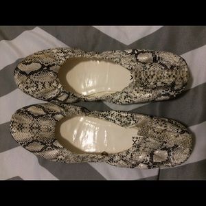 Miley Cyrus Aztia snakeskin ballerina shoes.