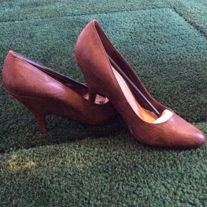 Brown (with a hint of black) wedged heels.
