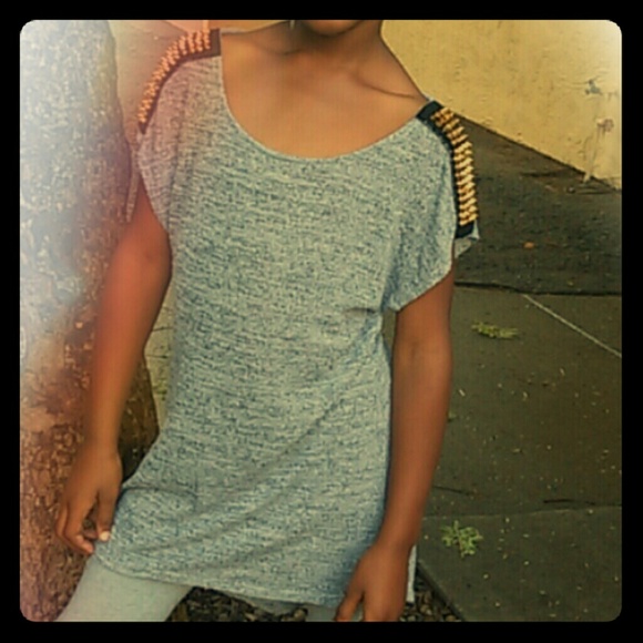 A gray knitted dress  with gold pokey thingy