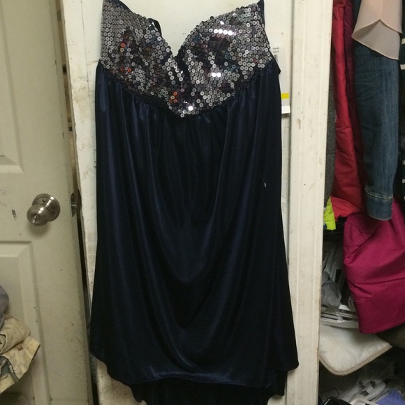 A dark blue hi-low dress, never worn,