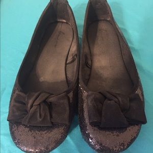 Black glittered ballet flats with velvet bow.