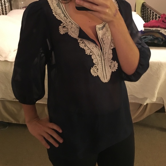 Fei, size medium, dark blue sheer top with lace.