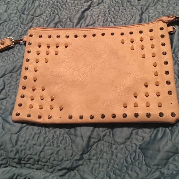 Tan colored leather studded clutch