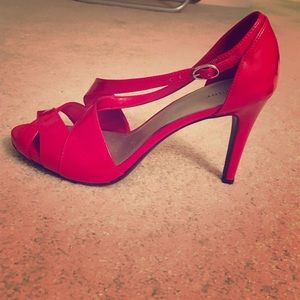 A pair of Fioni red heels that are a size 9