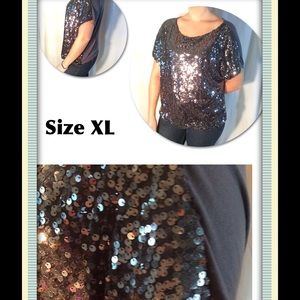 Jennifer Lopez sequin top.