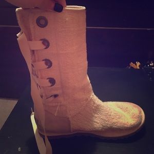 A pair of high lace up uggs