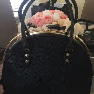 Black handbag with gold hard wear