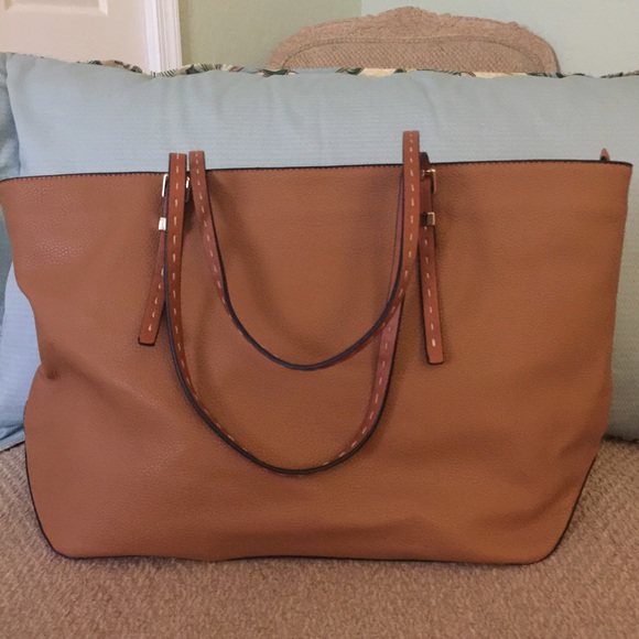 Brown vegan material looks and feels like leather
