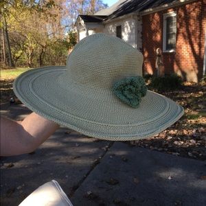 Cream hat with green flower