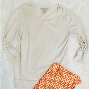 Cream sweater.