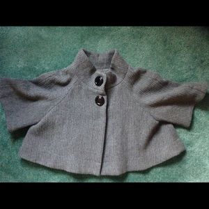 Gray cape/poncho style half body coat