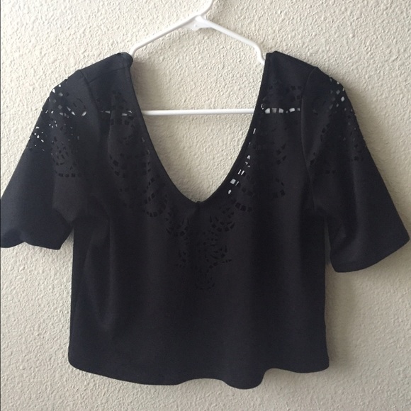 Black laser cutout top from  Urban outfitters