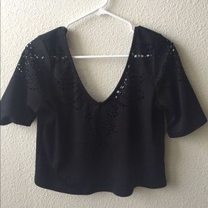Black laser cutout top from  Urban outfitters