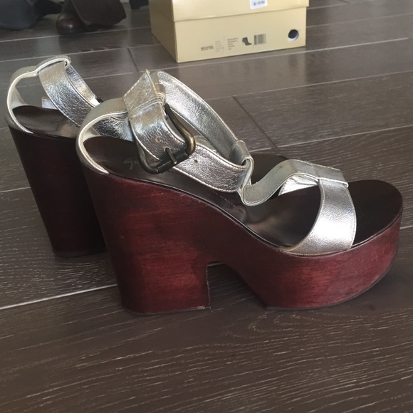 Barely worn, but has a tiny dent on the left heel