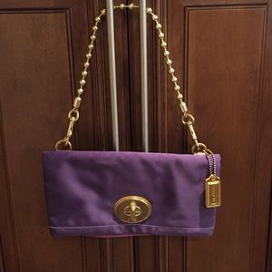 Coach clutch with strap