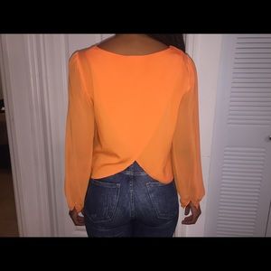 Beautiful tangerine blouse.