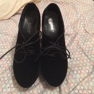 delicacy black boots with wedge heal. Worn once