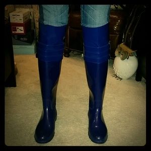 Bright blue knee high Calvin Klein rain boots