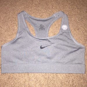 Gray racerback NIKE DRI-FIT sports bra