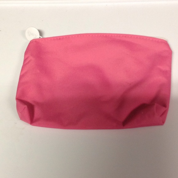Pink and white ipsy cosmetic bag
