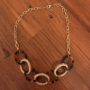 Tortoise shell and rhinestone statement necklace.