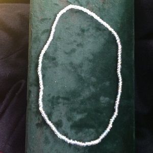 White beaded necklace.