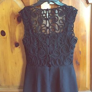 Black sleek dress with full back lace detail.