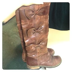 Brown leather boots with bows from Anthropologie