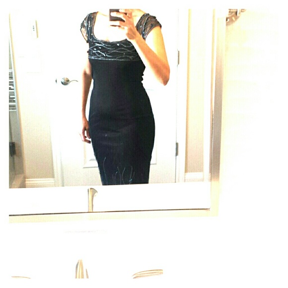 A sexy black with beads cocktail dress.