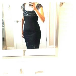 A sexy black with beads cocktail dress.