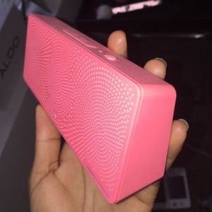A Coral Pink Bluetooth speaker