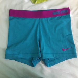Blue and purple Nike Pros