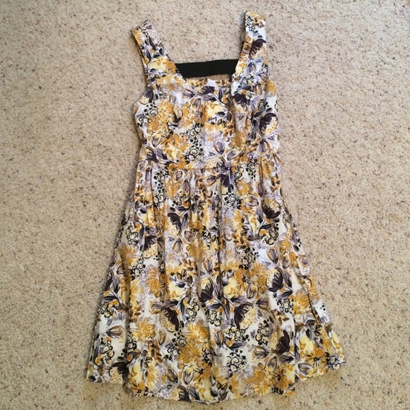 Sleeveless black and yellow dress with ladder back