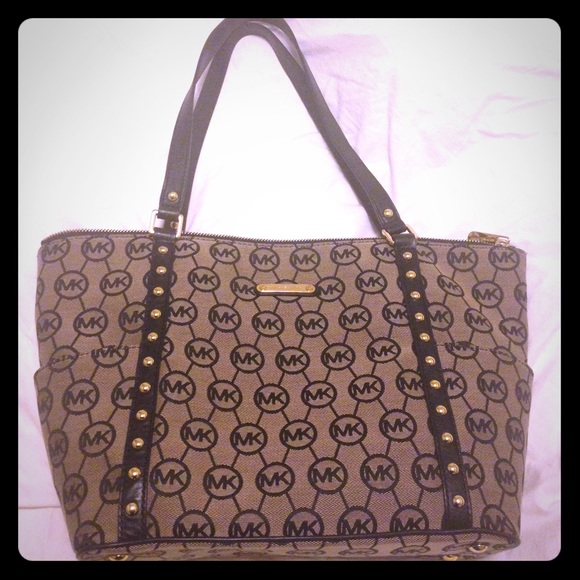 Michael Kors black and tan tote bag.