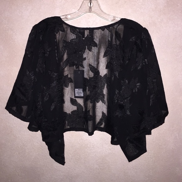 The BuckleCropped black jacket with floral design. - Picture 2 of 3