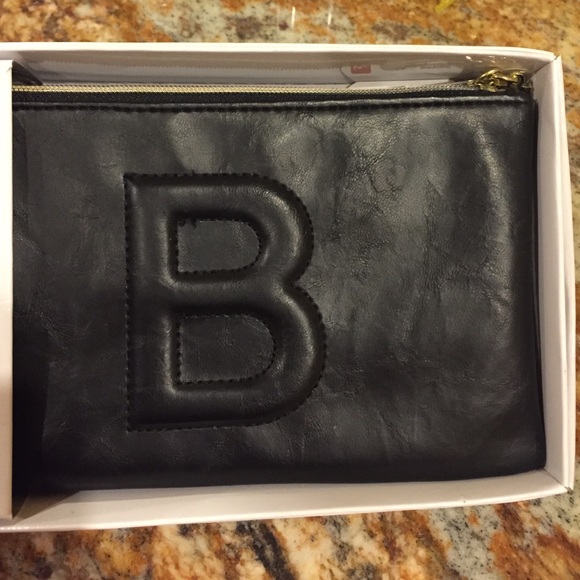 Mundi wristlet with the initial "B"