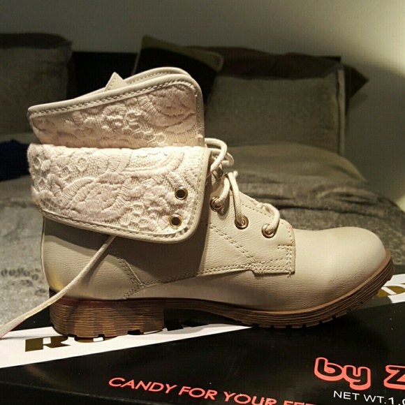 Cream and taupe colored boots