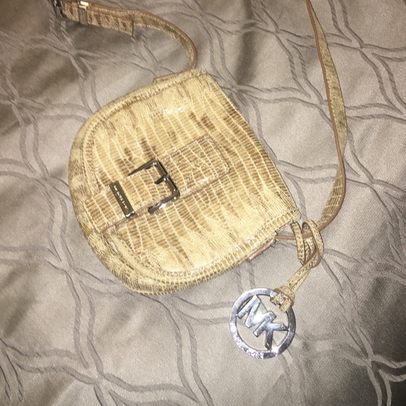 Great small tan Michael Kors cross body bag!