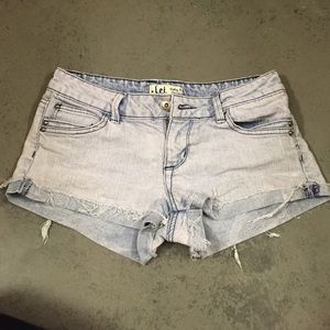 Lightwash purple shorts with dark purple stitching