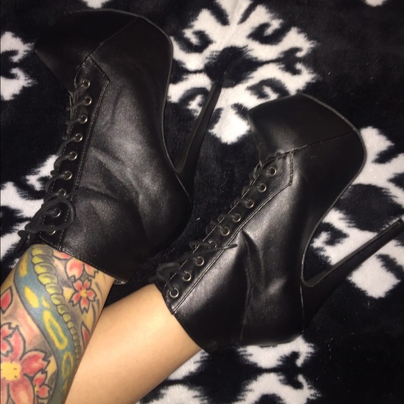 Black lace up leather booties.