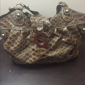 Good condition GUESS purse with matching wallet!