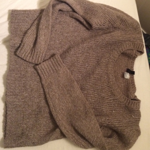 A light colored gray/brown sweater